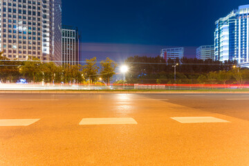 Wall Mural - the light trails on the modern building background in shanghai china.