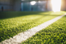 Football Field Sideline At Sunny Day. Soccer Pitch Background. Summer Day At Sports Field. Sunlight In The Background