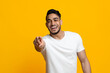 © Prostock-studio - Laughing middle eastern guy pointing at camera