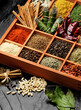 assorted spices and herbs in wooden box