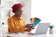 © Prostock-studio - Stylish young black woman independent contractor having video conference