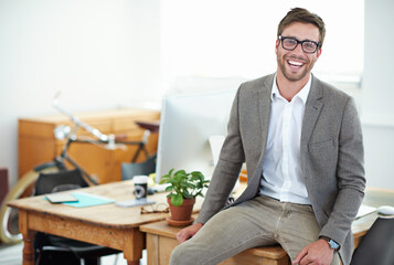 Poster - Small business success story. Portrait of a handsome male designer in his modern office.