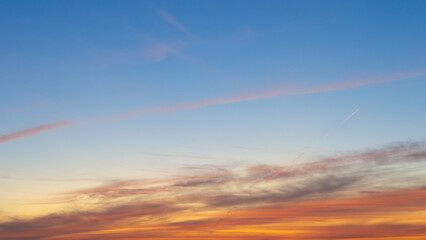Wall Mural - beautiful vivid sky painted by the sun leaving bright golden shades.dense clouds in twilight sky in 