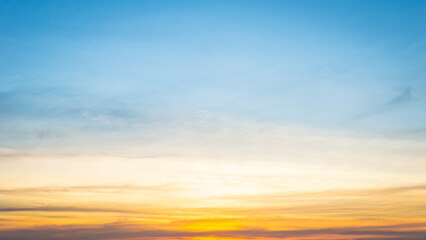 Beautiful Vivid sky painted by the sun leaving bright golden shades.Dense clouds in twilight sky in winter evening.Image of cloud sky on evening time.Evening Vivid sky with clouds.