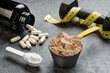 Scoops with protein and creatine close-up. The concept of sports nutrition and supplements.