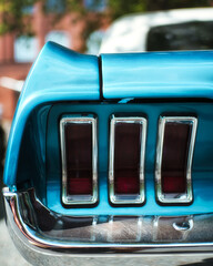 Wall Mural - Closeup shot of the details of a blue vintage car