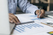 © Wasan - Businessmen use calculators to calculate budgets and analyze business profit growth. Financial planning and business accounting concepts.