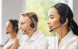 © Acronym - Team of professional support staff working in the office. Colleagues in the workplace solve customer problems. Call center and customer support concept.