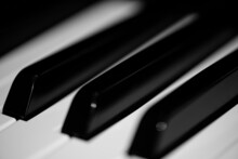 Grayscale Shallow Focus Detail Of White Black Piano Keys