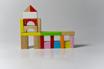 Sticker - Closeup of a house made out of colorful wooden building blocks