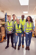 © Monkey Business - Portrait Of Multi-Cultural Team Wearing Hi-Vis Safety Clothing Working In Modern Warehouse