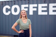 © Monkey Business - Portrait Of Female Intern At Freight Haulage Business Standing By Shipping Container