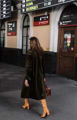 Sticker - Beautiful Caucasian female tourist at a train station