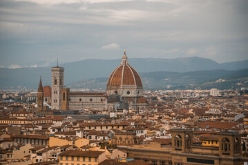 view of florence cathedral (cathedral of saint mary of the flower) in a background of mountains