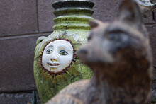 Closeup Of A Craft Bottle With A Freak Face Next To A Shallowed Craved Wombats Animal