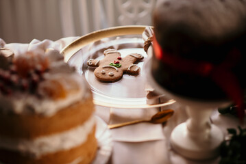 Canvas Print - Gingerbread man and other Christmas pastry on the table