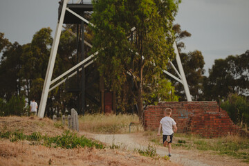 Closeup of a boy running outside