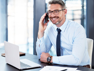 Aufkleber - Keeping his connections close. Shot of a mature businessman on a call in an office at work.