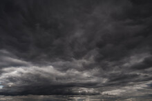 Background Of Dark Dramatic Sky With Stormy Clouds Before Rain Or Snow, Extreme Weather