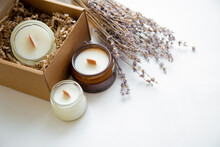 An Open Box With Candles On A White Background, Next To It Are Several Candles In A Jar And A Dried Bouquet Of Lavender. High Quality Photo