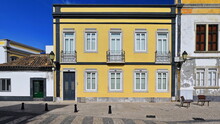 Neoclassical House-yellow Facade-metal Railing-balcony And Balconets-closed Door And Windows. Faro-Portugal-151
