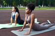 © etonastenka - Active lifestyle in the city. Image of young women doing stretching after running workout