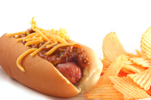 Hot Dog With Chili And Cheese With Chips Isolated On White