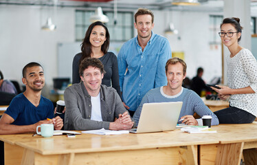 Poster - Theyre a team that gets it right the first time. Portrait of a group of colleagues working together in a casual work environment.