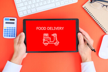 Poster - Hand used a tablet with order food delivery on desk