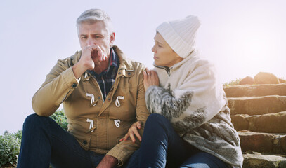 Poster - Everything is going to be fine, dont worry yourself. Shot of an elderly couple looking very worried while sitting down outdoors.