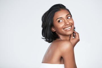 W e all want to look our best with minimal effort. Shot of a beautiful young woman posing against a white background.