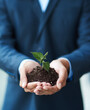 © Lyndon Stratford/peopleimages.com - The start to new successes. Cropped shot of a businessman holding a plant growing in soil.