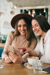 women friends on coffee break at cafeteria