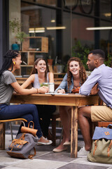 Sticker - Nothing better than the company of friends. A group of young friends sitting outside at a sidewalk cafe.