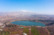 Hermon mountain covered with snow, over lake Ram, Aerial view.
