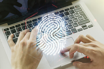 Aufkleber - Double exposure of abstract creative fingerprint hologram with hands typing on laptop on background, protection of personal information concept