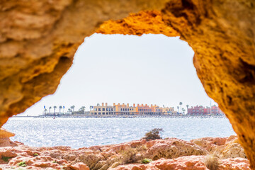 Wall Mural - Beautiful sandstone arch with the view on marina in Portimao, Ferragudo, Algarve, Portugal