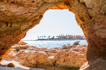 Wall Mural - Beautiful sandstone arch with the view on marina in Portimao, Ferragudo, Algarve, Portugal