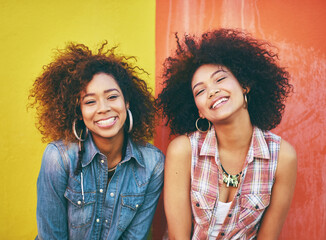 Aufkleber - Fashionable friends. Portrait of two young friends posing against a colorful background.