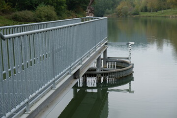 Wall Mural - FU 2020-10-17 Gerolstein 271 Ein Steg mit Geländer führt ins Wasser