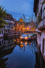 Wall Mural - Strasbourg, France - May 23, 2017: .Night cruise on the ILL canal, Strasbourg, Alsace, Bas-Rhin Department, France