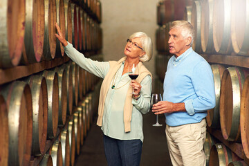 Poster - Seems like its been a great year. Cropped shot of a senior couple enjoying a little wine tasting.