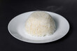 © tonefotografia - rice on white plate over black background studio