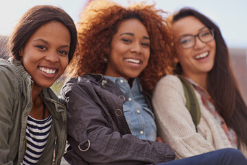 Wall Mural - A day without laughter is a day wasted. Cropped shot of girlfriends bonding on campus.