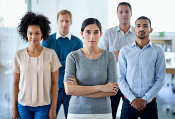 Poster - Standing together for success. Portrait of a group of diverse colleagues standing in an office.