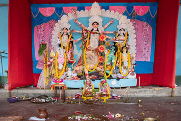 Goddess Durga idol at decorated Durga Puja pandal, at Kolkata, West Bengal, India. Durga Puja is biggest religious festival of Hinduism and is now celebrated worldwide.