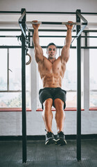 Poster - aim high. shot of a muscular man working out in a gym.