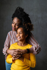 Wall Mural - Family portrait. Loving mother and daughter at home hugging. Love, people, happiness concept.