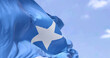 Detail of the national flag of Somalia waving in the wind on a clear day