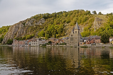 Wall Mural - 
Church and houses along river Meuse under the cliffs of Dinant
